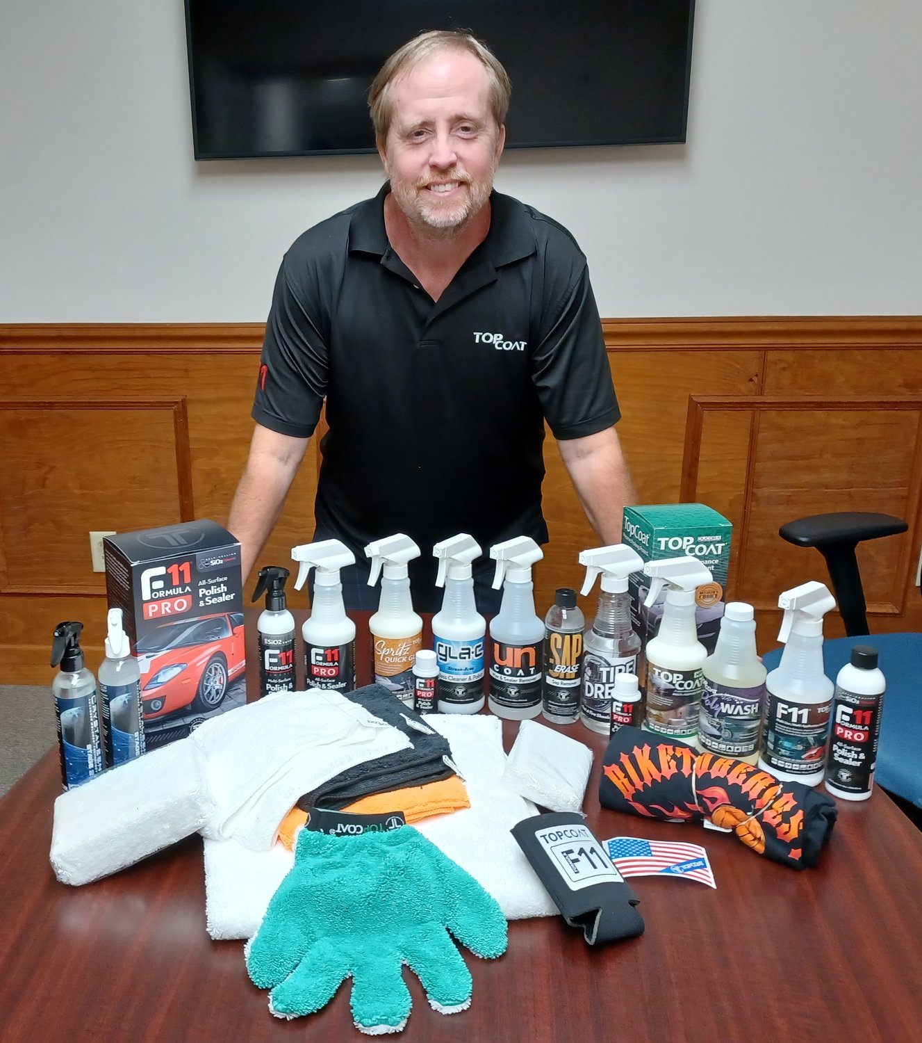 TopCoat Products founder Scott Smith shows off his company’s many products.